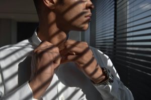 Man wearing white button down shirt