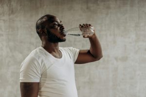 Chubby man drinking water