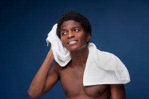 Man toweling his face
