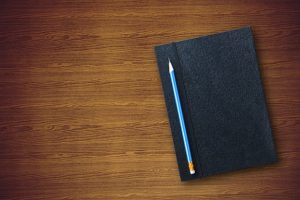 Notebook with a pencil