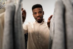 Man going through wardrobe 