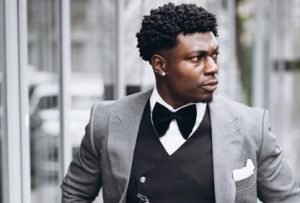 Man wearing detailed clothing 