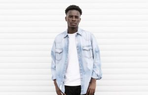 Man dressed in casual denim jacket and t-shirt