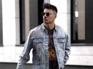 Man wearing denim over graphic tshirt