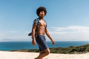 Man wearing shorts at beach 