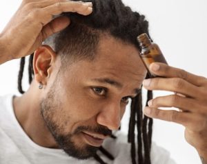 Man using hair oil 