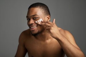 Man using moisturizer