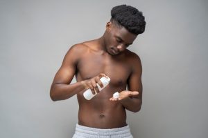 Man applying sunscreen 