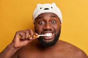 Man using toothbrush 