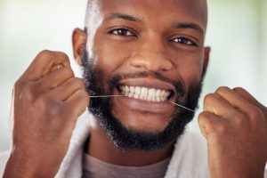Man using dental floss