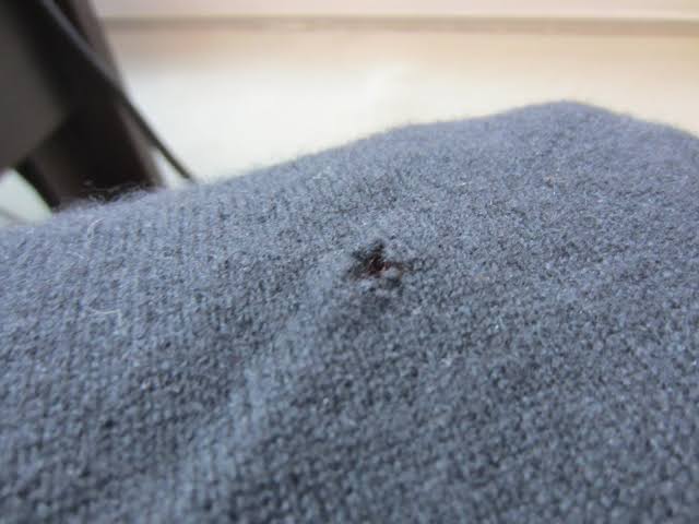 Sweater with a hole
