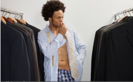 Man deciding on clothes